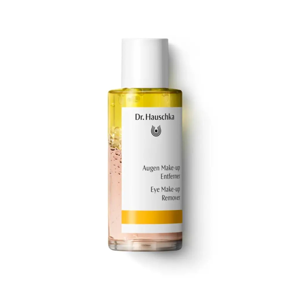 Dr. Hauschka Eye Make-up Remover in a clear bottle with yellow liquid.