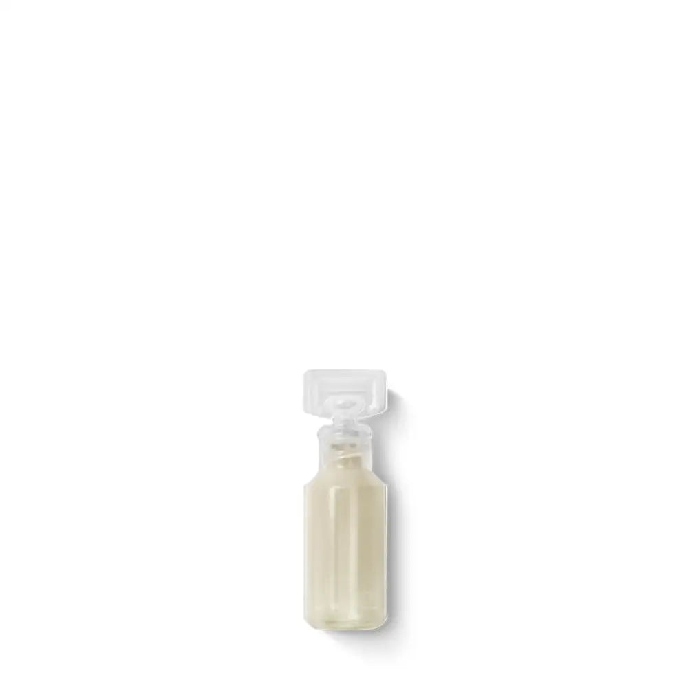 Clear spray bottle containing a light-colored liquid.