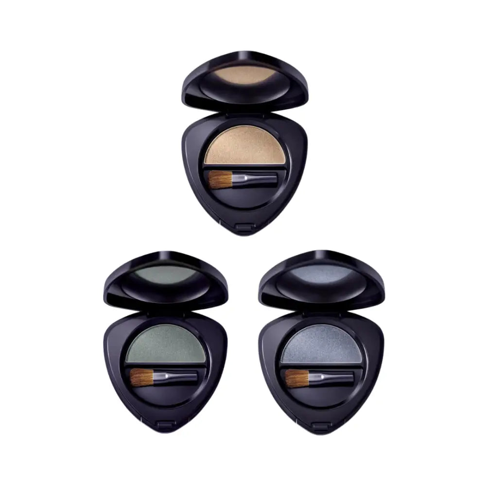 Three teardrop-shaped eyeshadow compacts in neutral shades with application brushes.