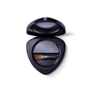 Black triangular compact case containing eyeshadow and a small brush.