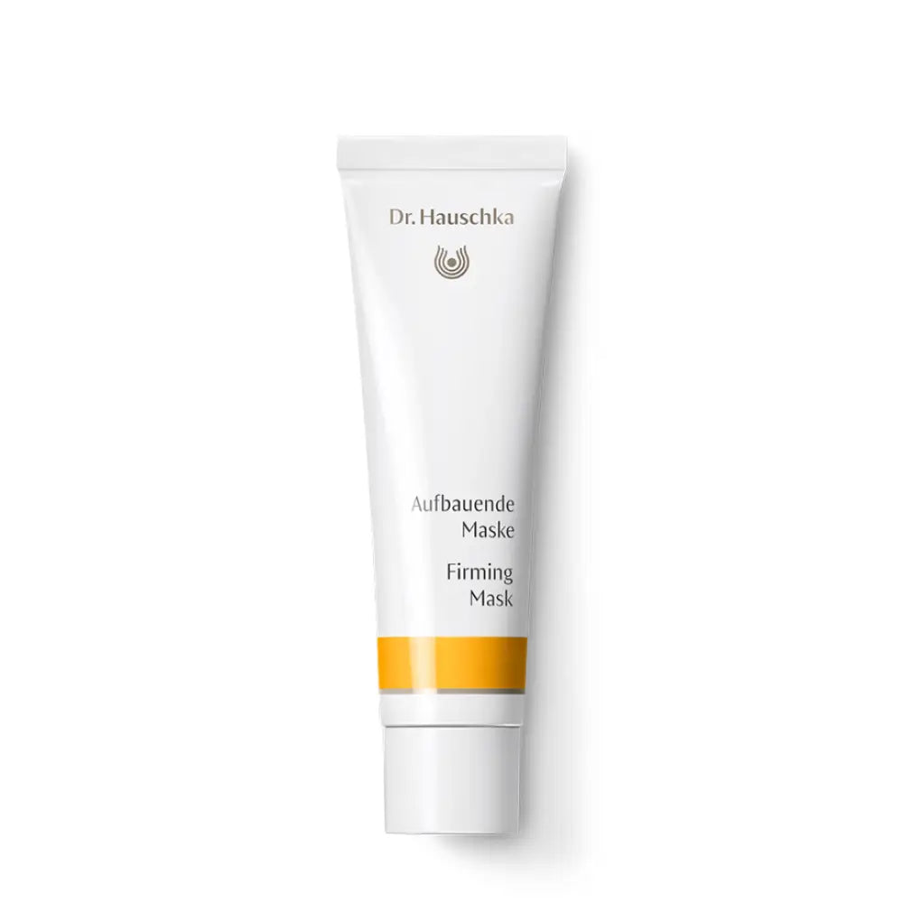 White tube of Dr. Hauschka Firming Mask with an orange stripe.