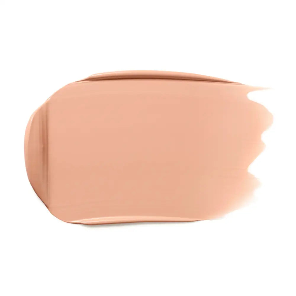 Peachy-beige cosmetic foundation smear with a smooth, creamy texture.