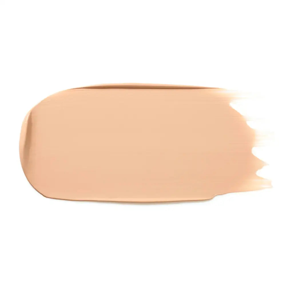 Peach-colored makeup foundation smear with a soft gradient edge.