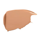 Beige foundation stick with a matte finish and smooth texture.