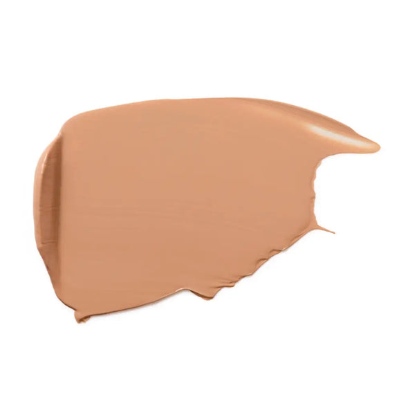 Beige foundation stick with a matte finish and smooth texture.