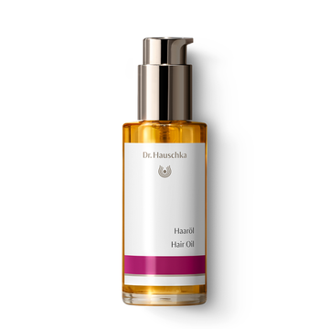 Bottle of hair oil with pump.