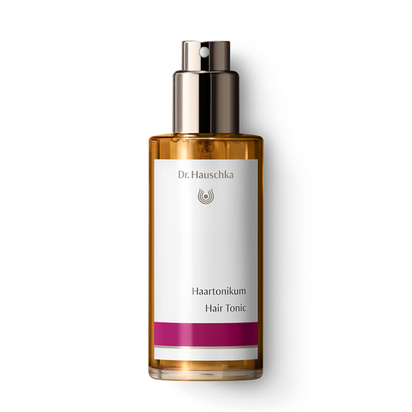 Dr. Hauschka hair tonic in a glass bottle with a pump.