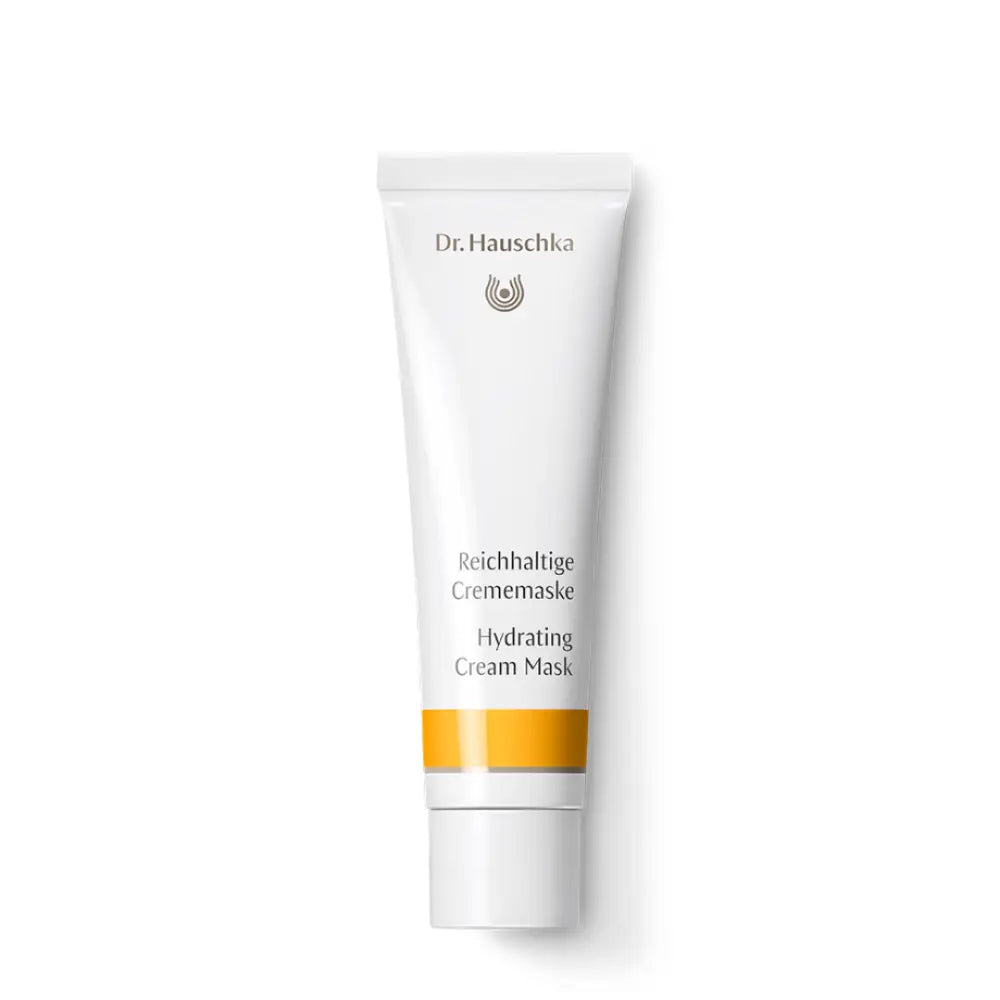 White tube of Dr. Hauschka Hydrating Cream Mask with an orange accent stripe.