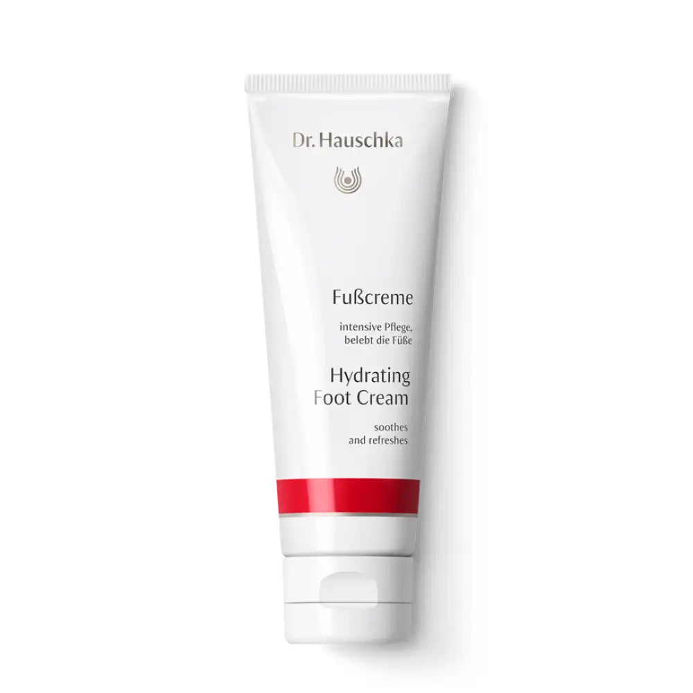 White tube of Dr. Hauschka Hydrating Foot Cream with red accent stripe.