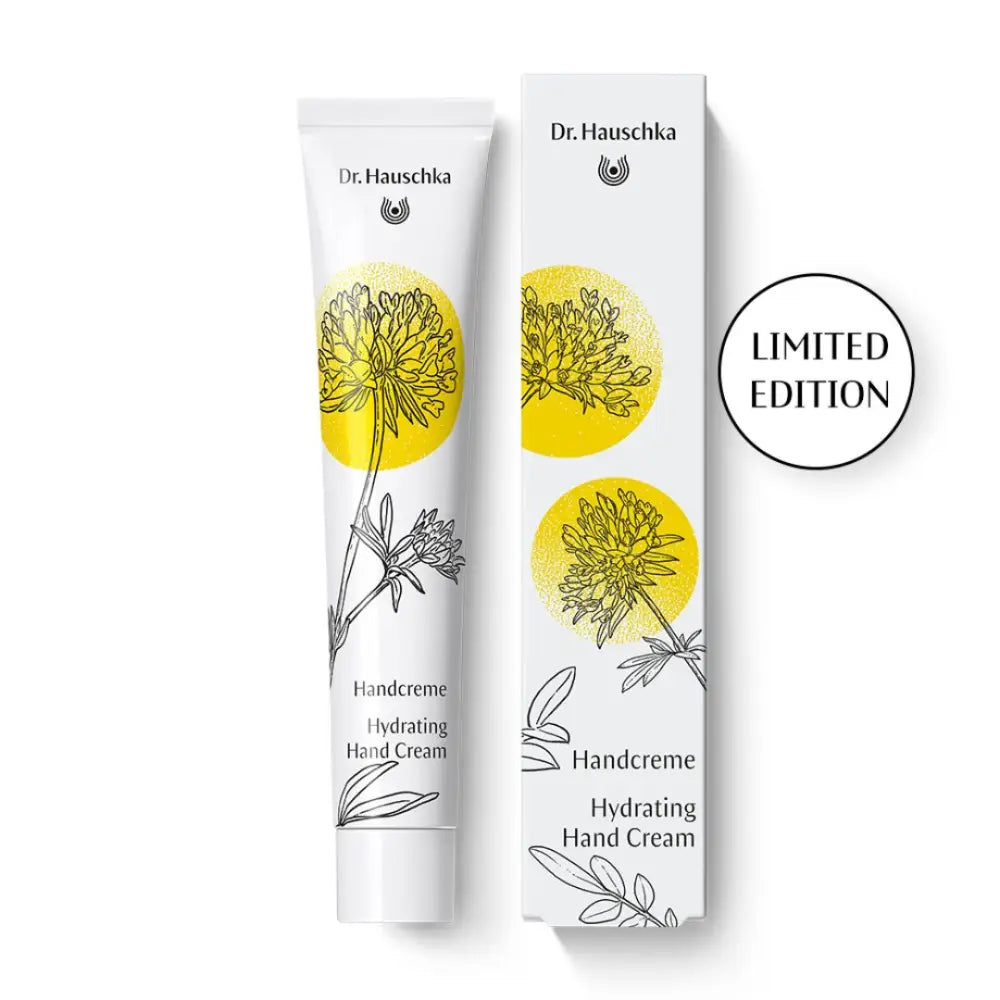 Limited edition Dr. Hauschka hydrating hand cream tube and box featuring yellow floral illustrations.