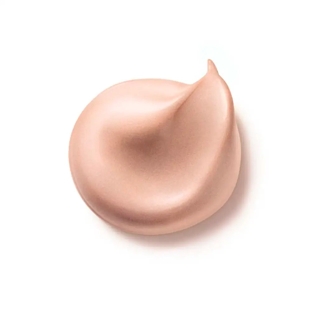 Swirled dollop of beige or nude-colored cream or foundation makeup.