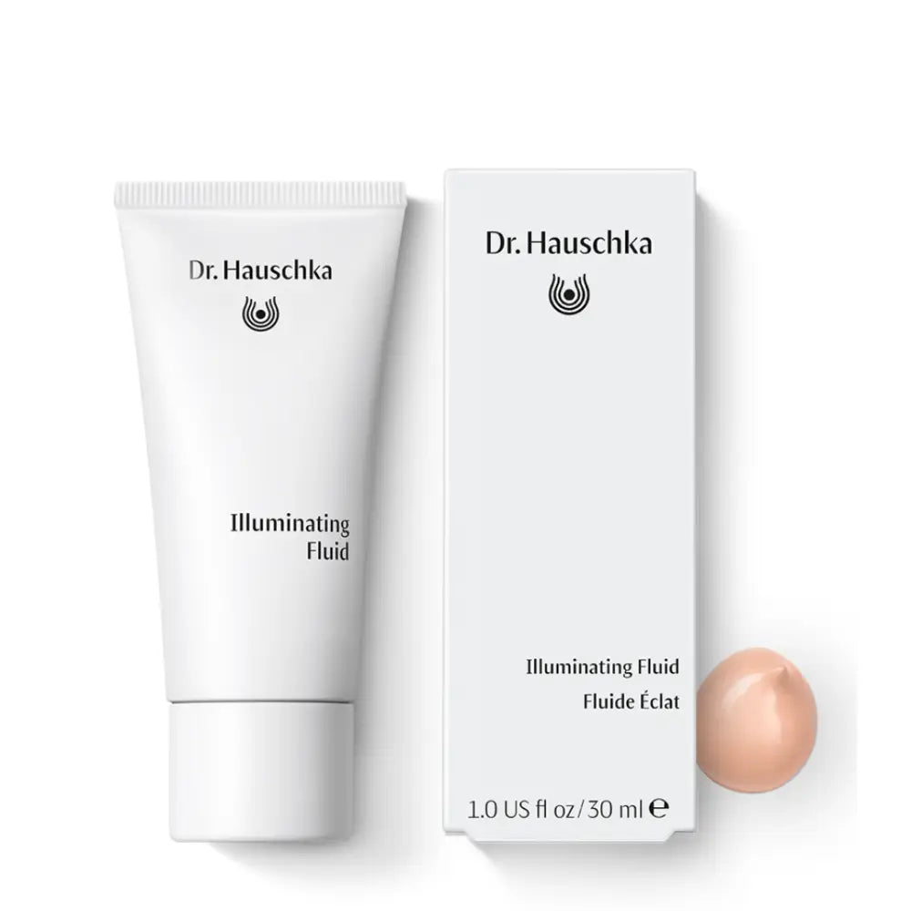 Dr. Hauschka Illuminating Fluid skincare product shown with its retail packaging and a sample of the pearlescent formula.