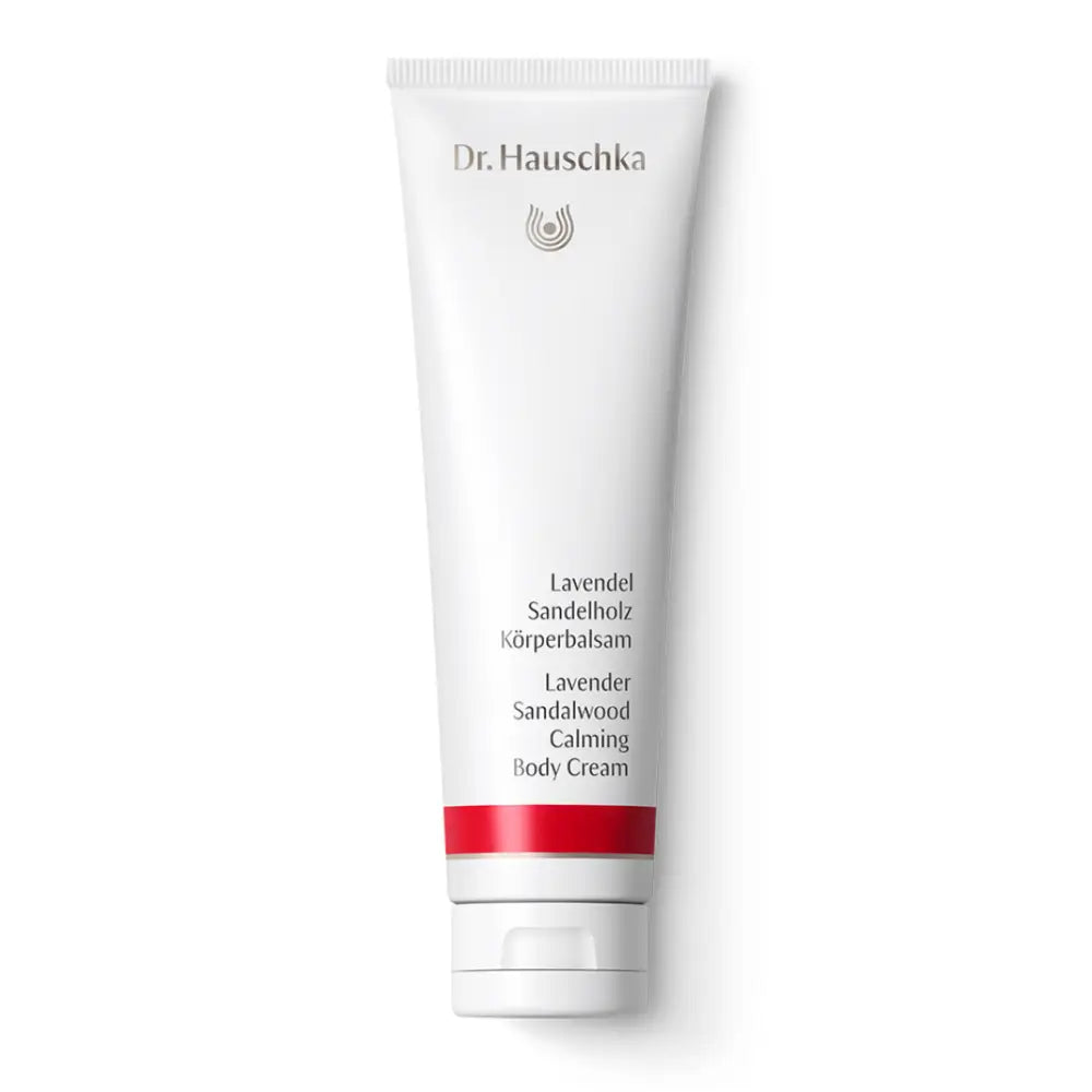 White tube of Dr. Hauschka Lavender Sandalwood body cream with red accent stripe.