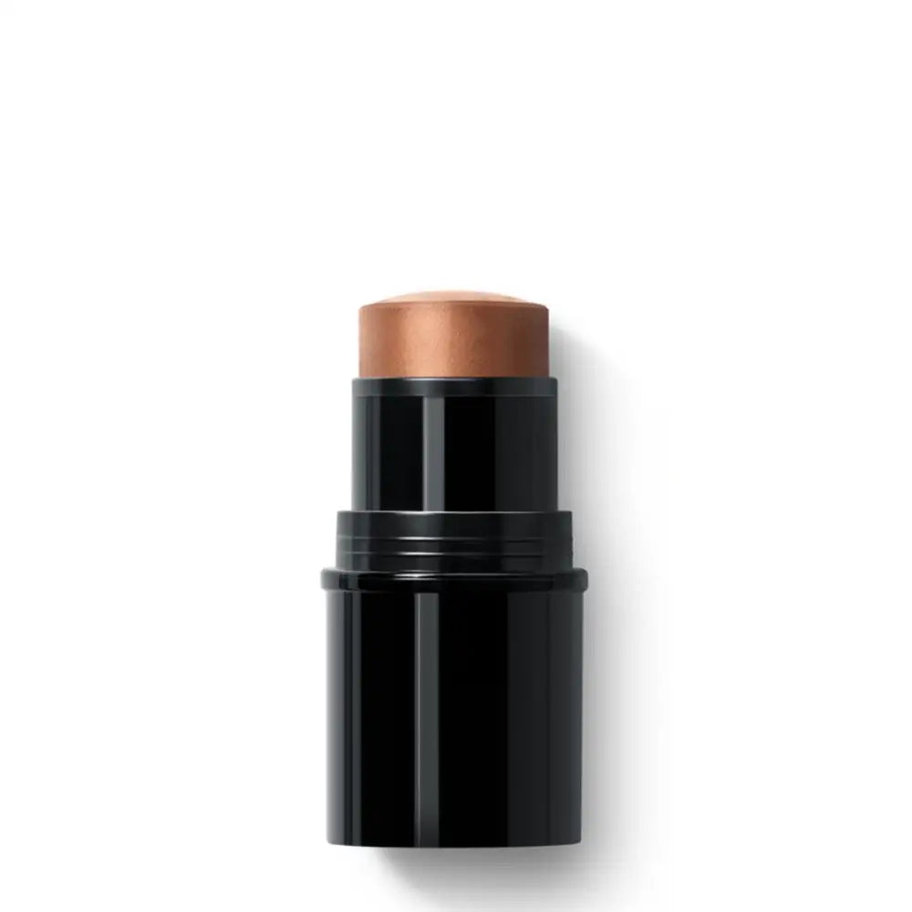 Black makeup stick with a copper-colored cream or foundation product at the top.