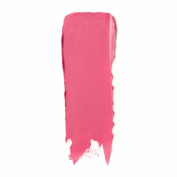 Pink lipstick smear or swatch showing texture and color.