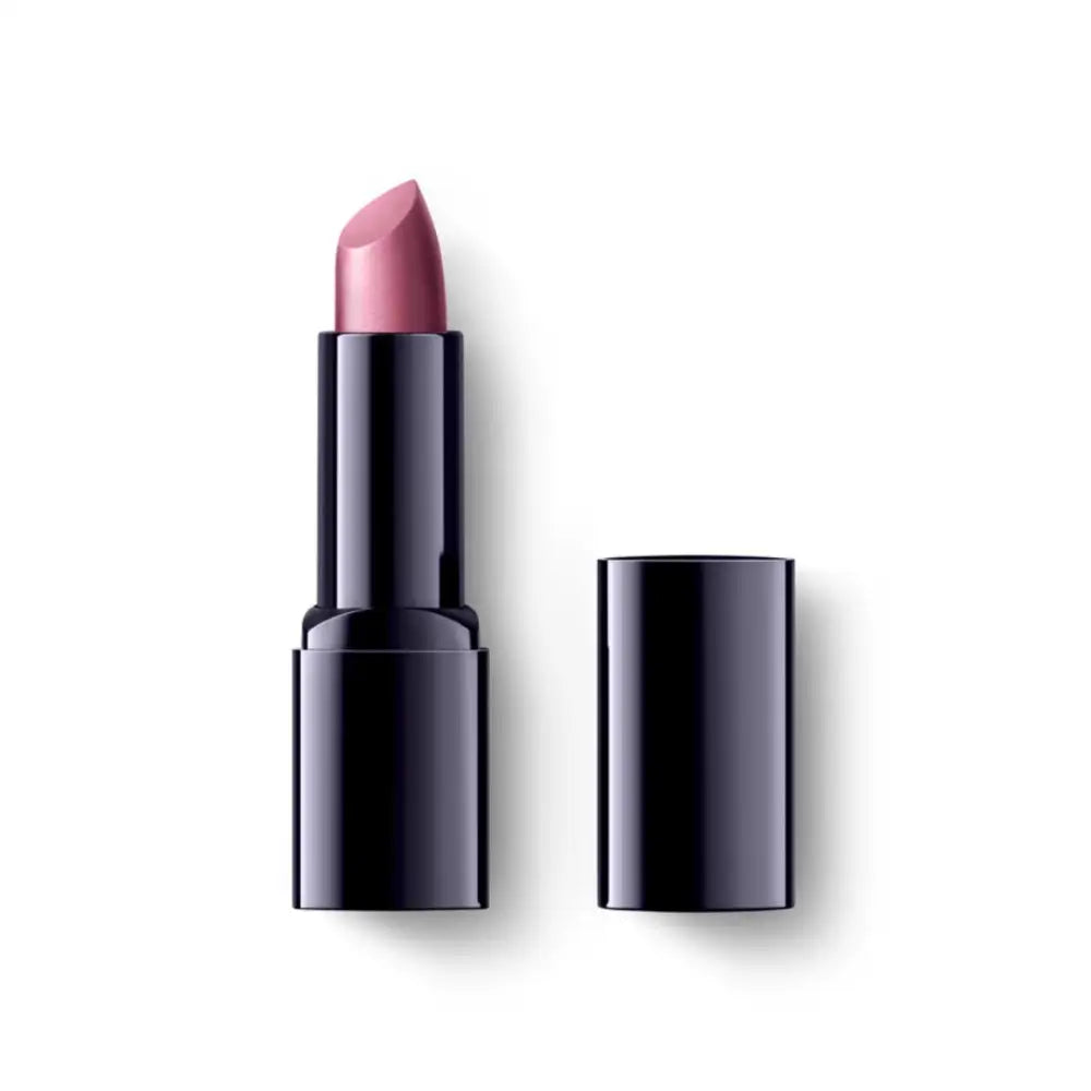 Pink lipstick in a black tube with its cap beside it.