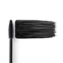 A black mascara wand and a thick, horizontal swipe of black mascara.