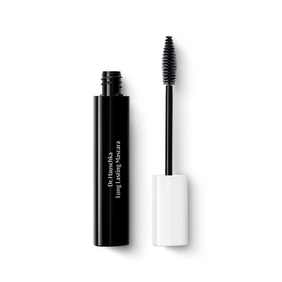 A black tube of Dr. Hauschka Long Lasting Mascara with its wand removed, displaying the brush.