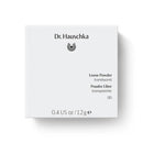 White Dr. Hauschka loose powder container with black text.