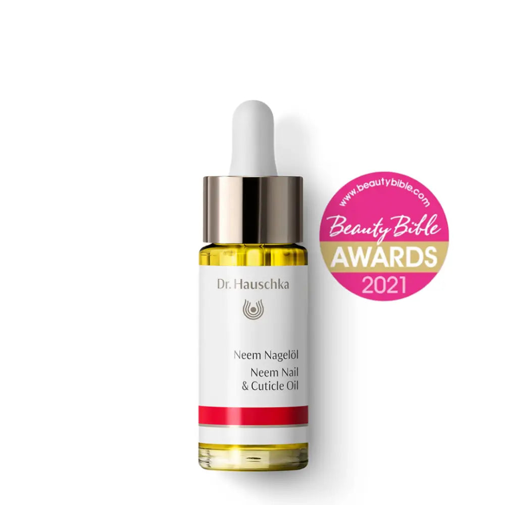 A Dr. Hauschka Neem Nail & Cuticle Oil bottle with a Beauty Belle Awards 2021 badge.