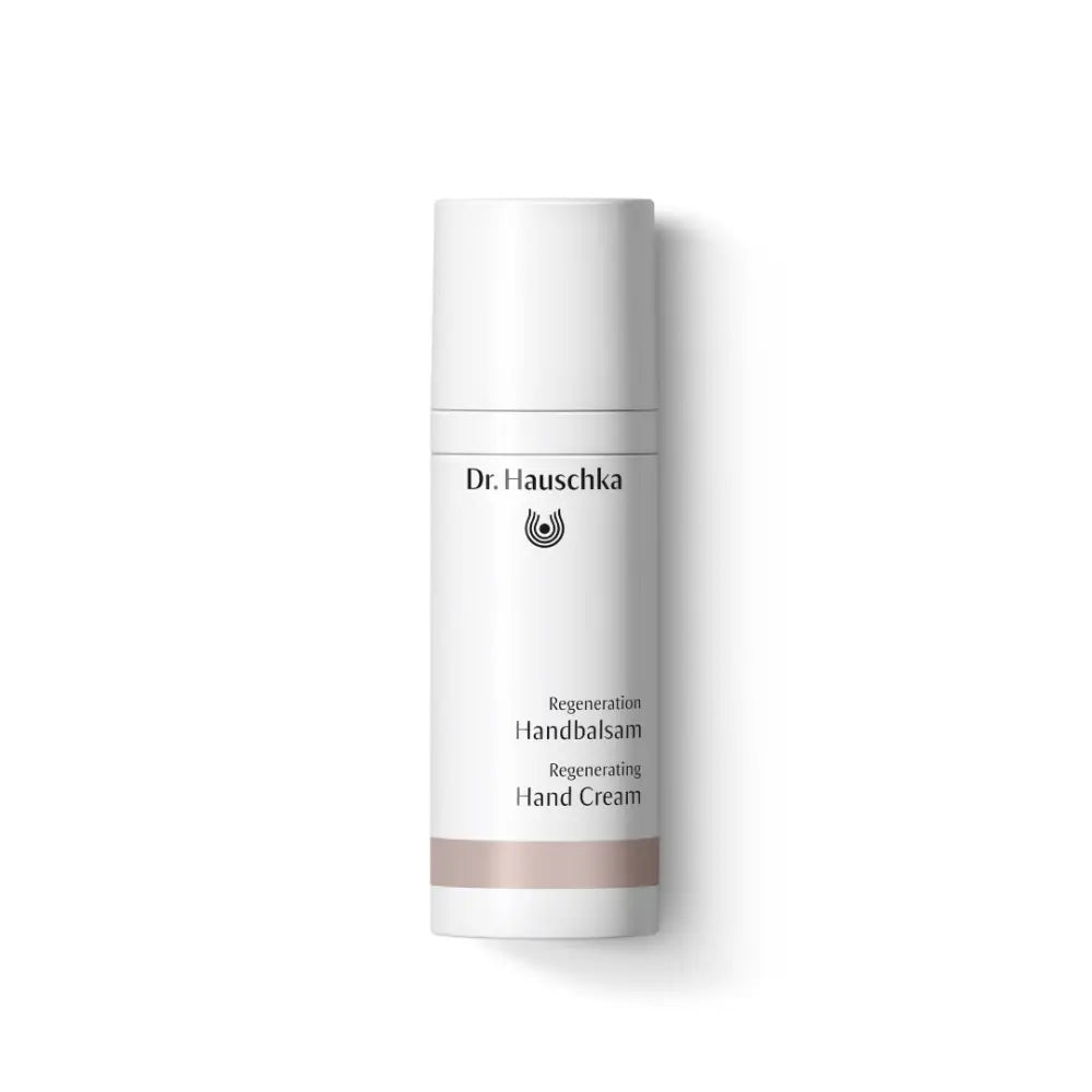 White bottle of Dr. Hauschka hand cream with minimal text and branding.