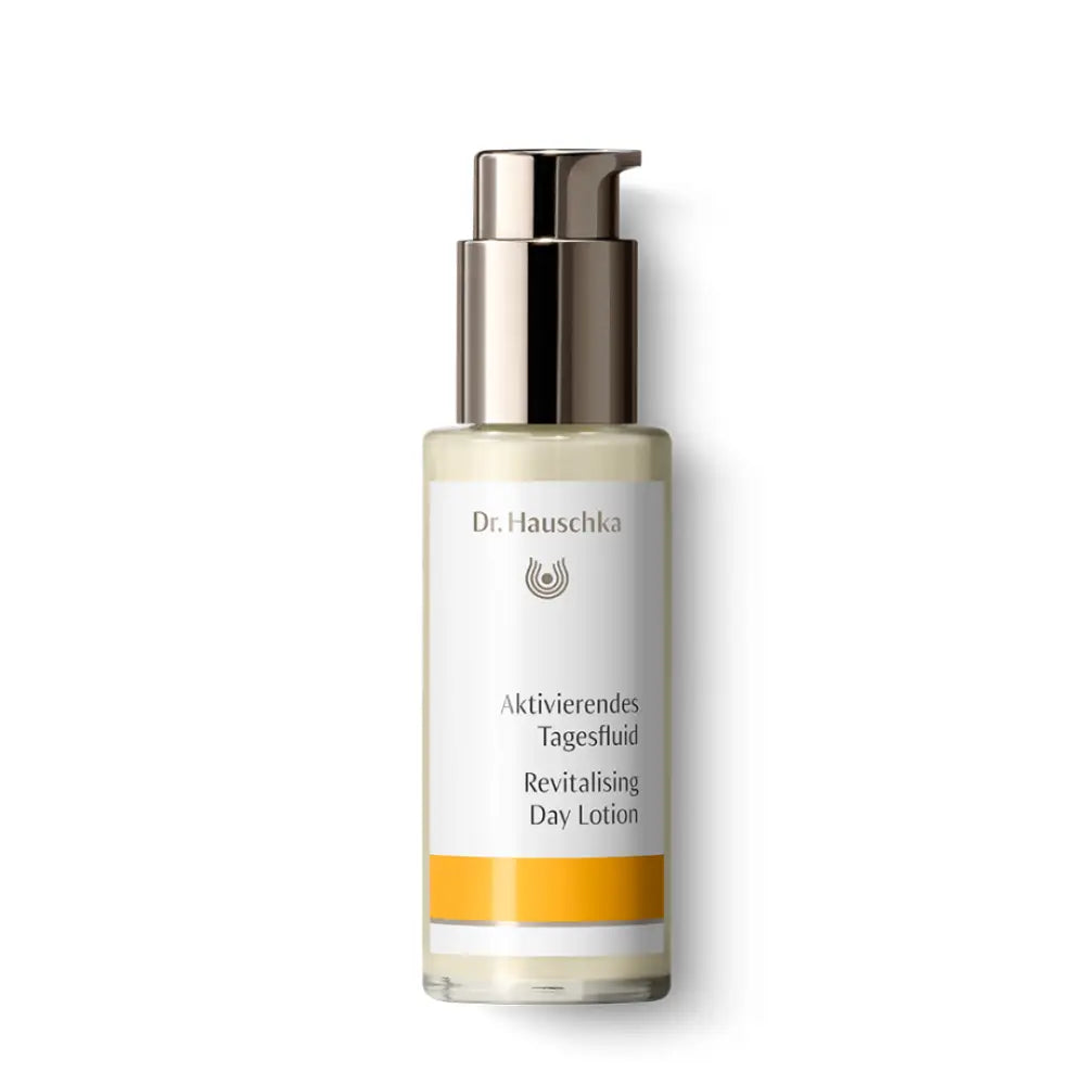 A bottle of Dr. Hauschka Revitalizing Day Lotion with a silver pump dispenser.