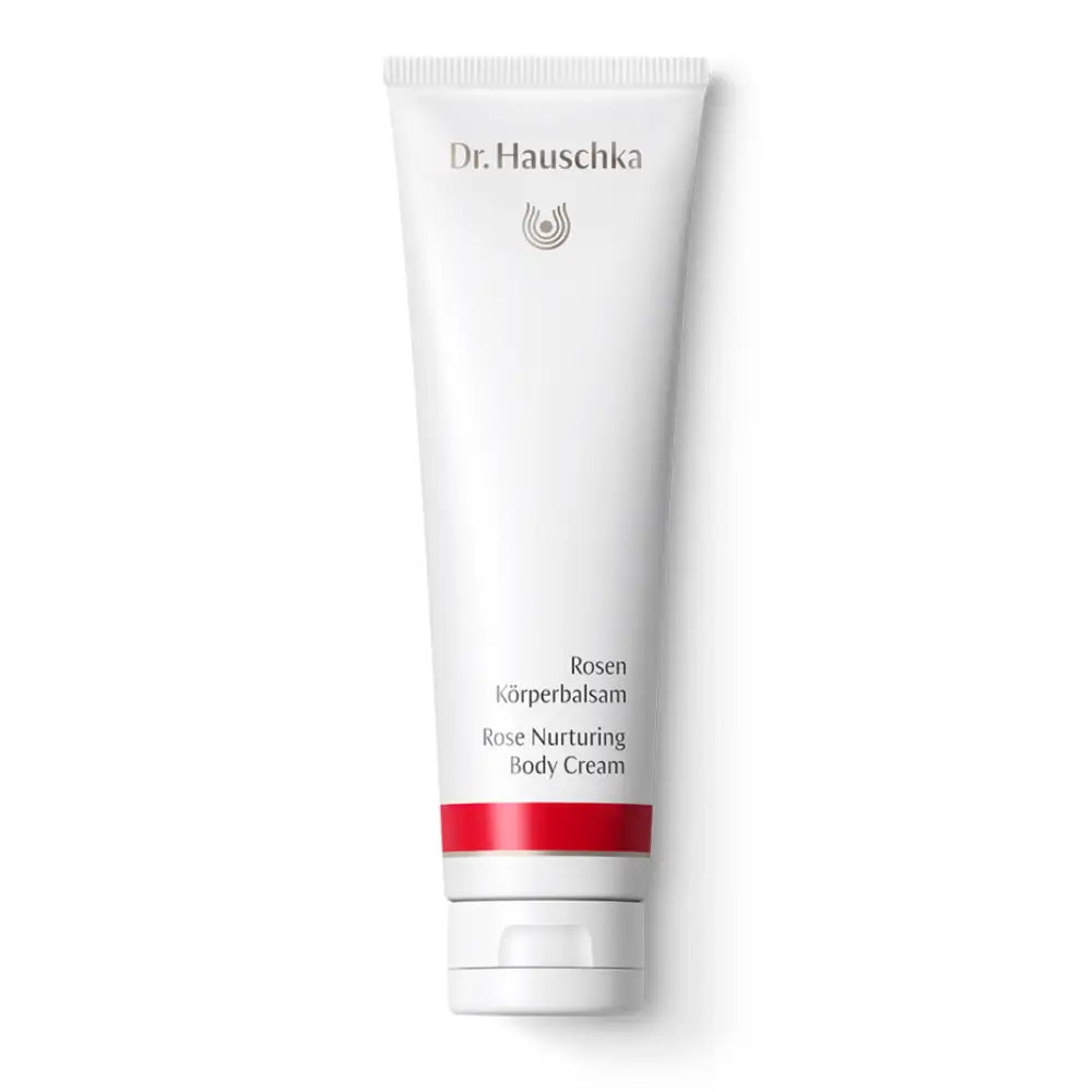 White tube of Dr. Hauschka Rose Nurturing Body Cream with a red accent stripe.