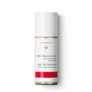 White bottle of Dr. Hauschka Sage-Mint deodorant with a red band near the bottom.