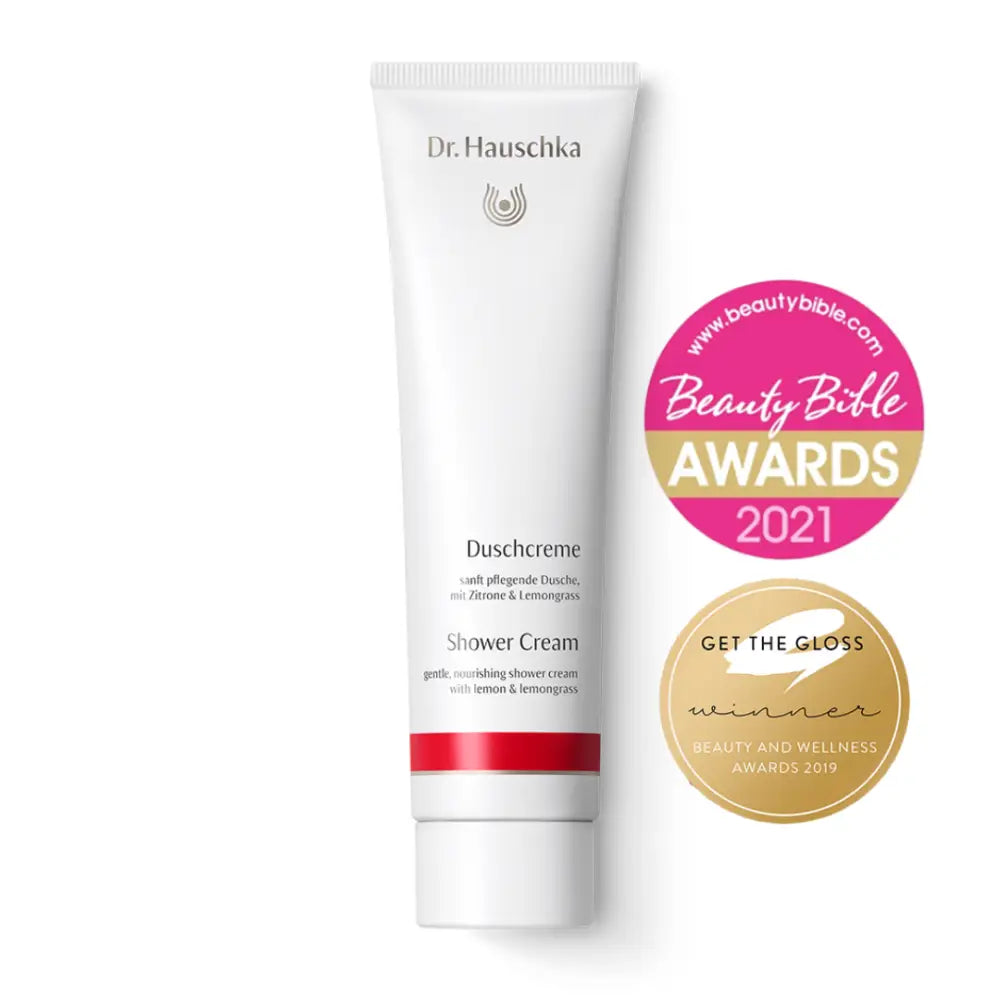 White tube of Dr. Hauschka shower cream with award badges.