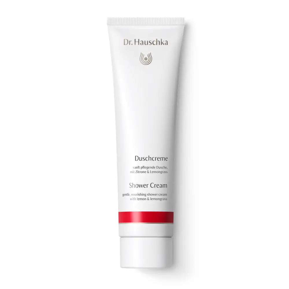 White tube of Dr. Hauschka shower cream with a red accent stripe.