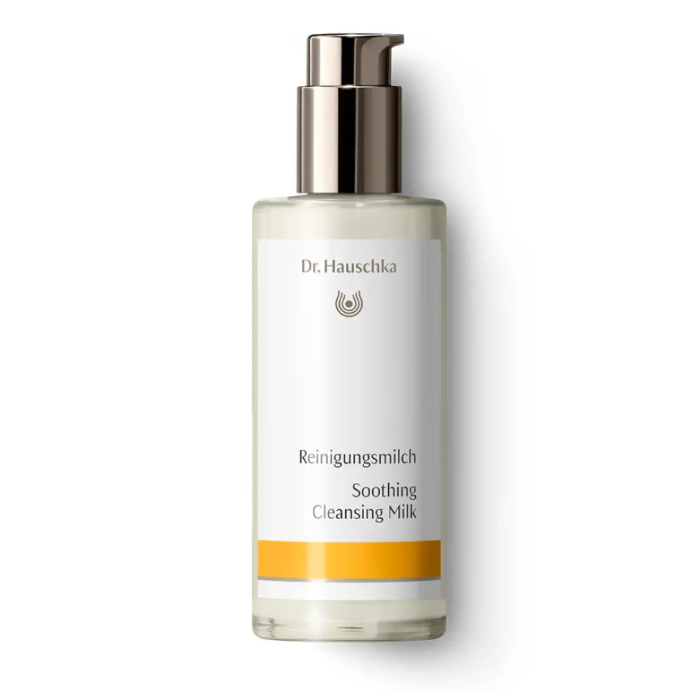 White bottle of Dr. Hauschka Soothing Cleansing Milk with a silver pump dispenser.