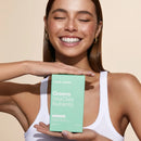 A mint green box of ’Greens Vital Daily Nutrients’ supplement product.