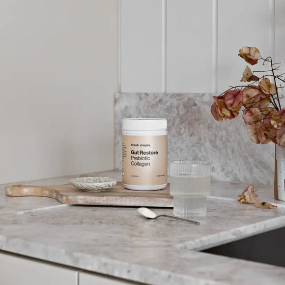 A container of Frank Simple gut restore prebiotic collagen supplement.