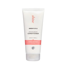 White tube of Green People natural beauty conditioner with coral-pink accents.