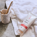 White tube of shampoo.