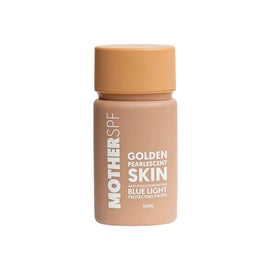 Pearlescent golden skin-toned bottle of Mother SPF sunscreen with blue light protection.