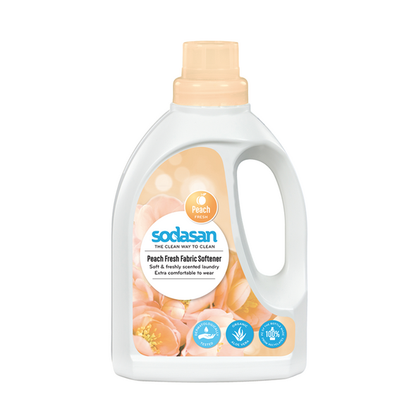 Peach-scented fabric softener in a white plastic bottle.