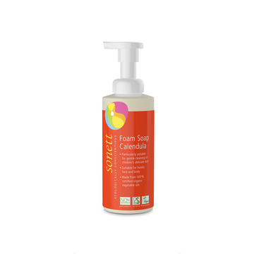 Orange bottle of foam soap with a pump.