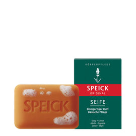 Orange-colored bar of Speick soap with its green product packaging box.