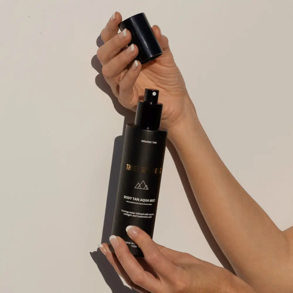 Black cosmetic or skincare product bottle with minimalist design.