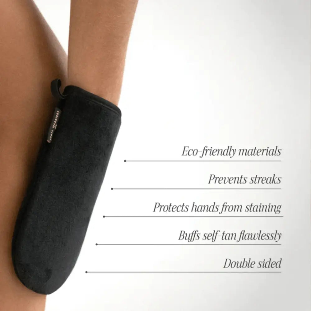 Black double-sided self-tanning mitt with labeled features.