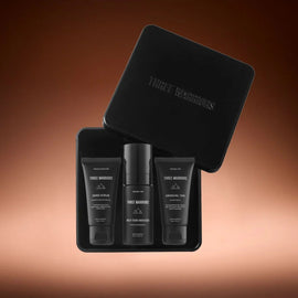 Three warriors mini natural tan products in a black tin with 'Three Warriors' branding on a brown gradient background.