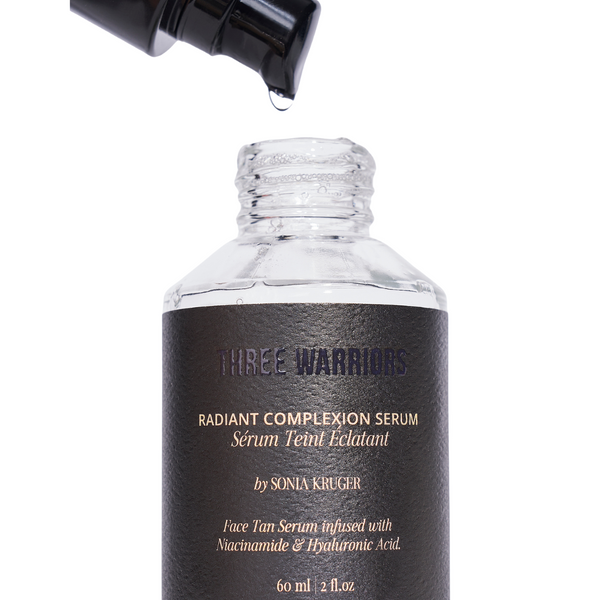 Close-up of Three Warriors Radiant Complexion Serum bottle, with lid and pump off. The face tan serum, is an overnight skincare, with the ingredients of Hyaluronic Acid, Marine Collagen, and Niacinamide.